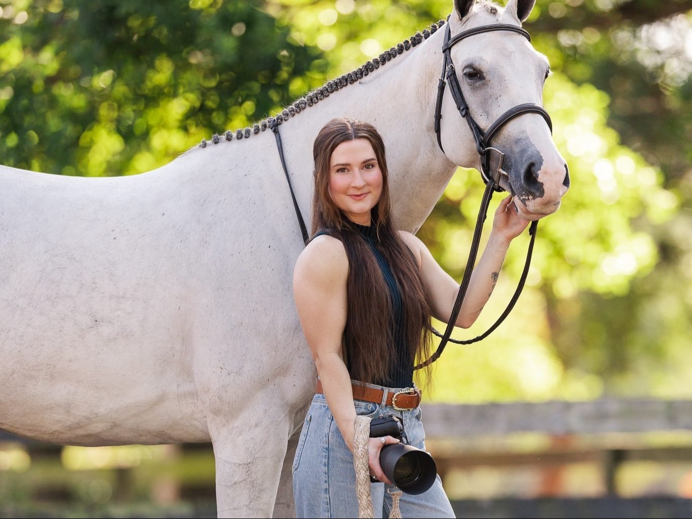 Photographer, Jeni Brunner, poses with her horse and camera.